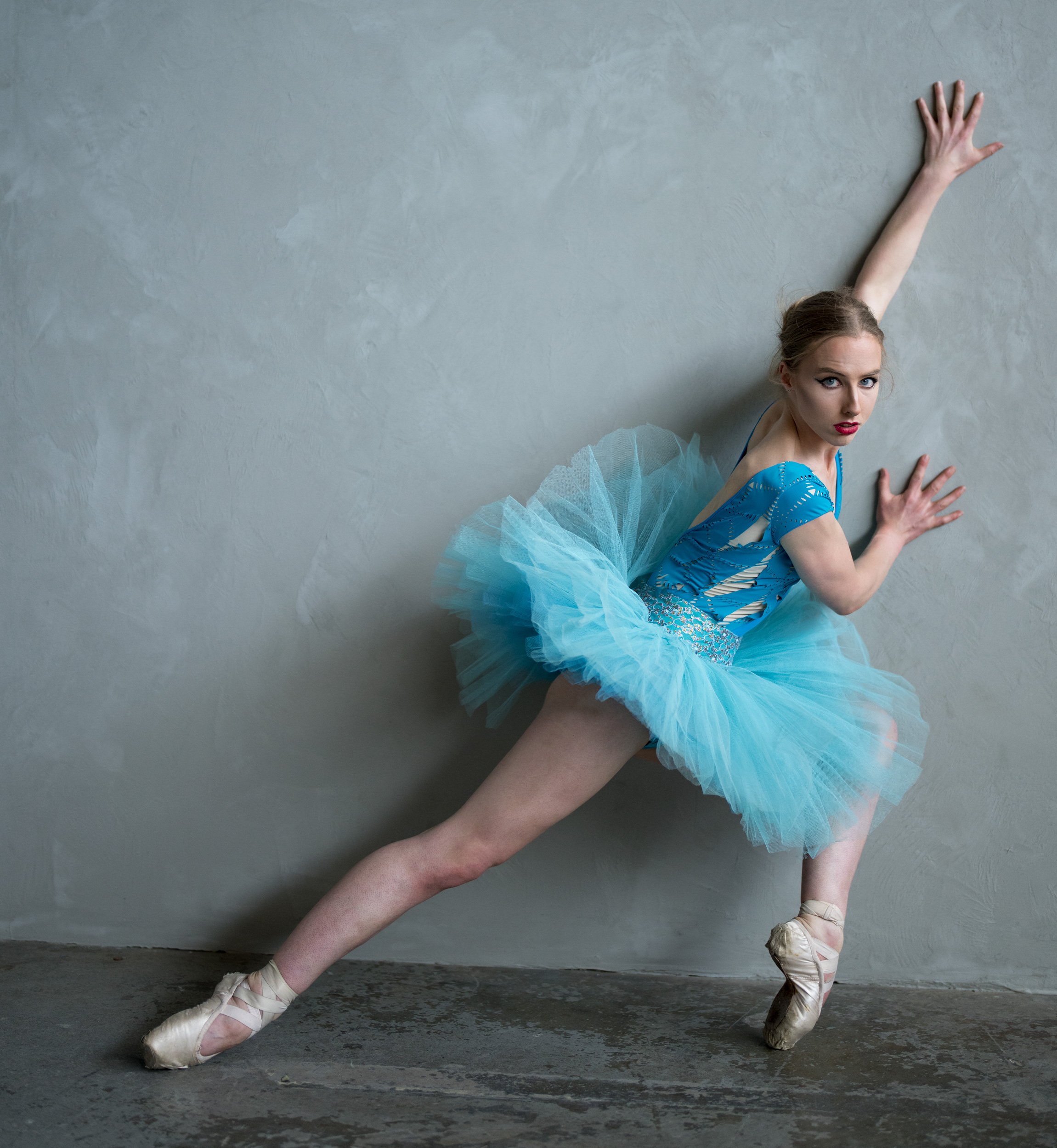 Natural light - a dancer against a wall